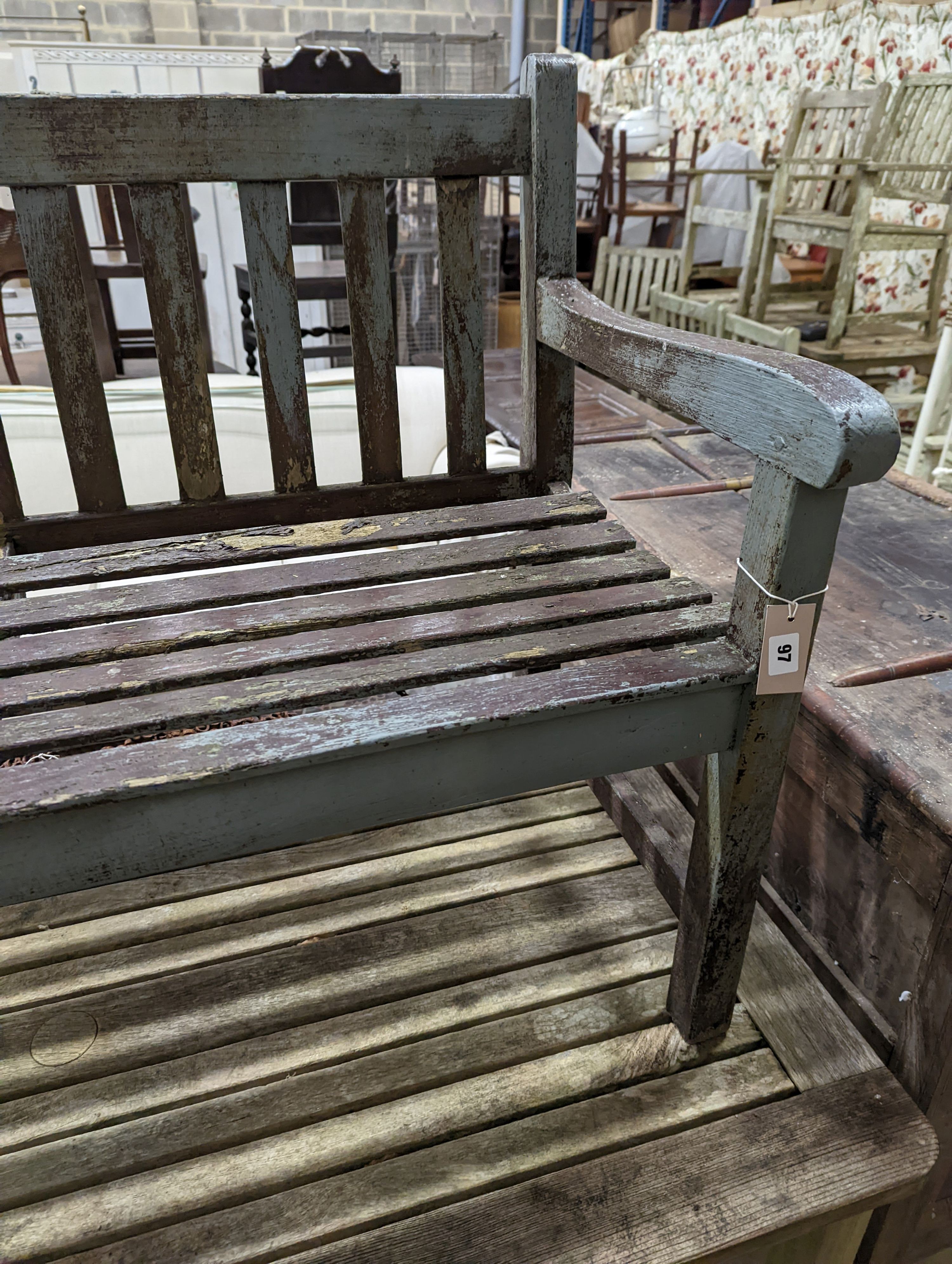 A weathered teak garden bench and rectangular table. Bench - W-122cm, D-54cm, H-83cm. Table - W-149cm, D-70cm, H-74cm.